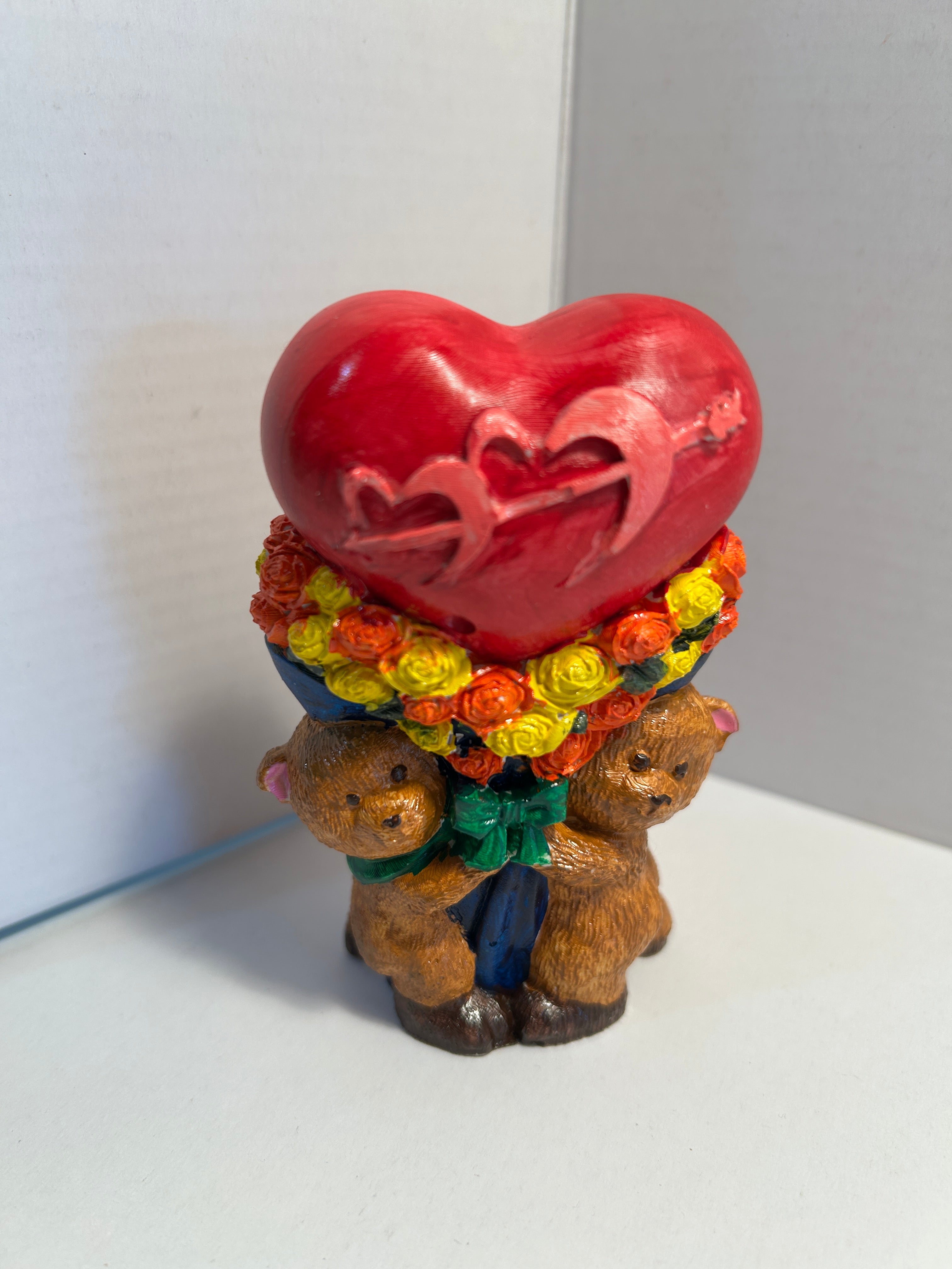 Bears holding heart