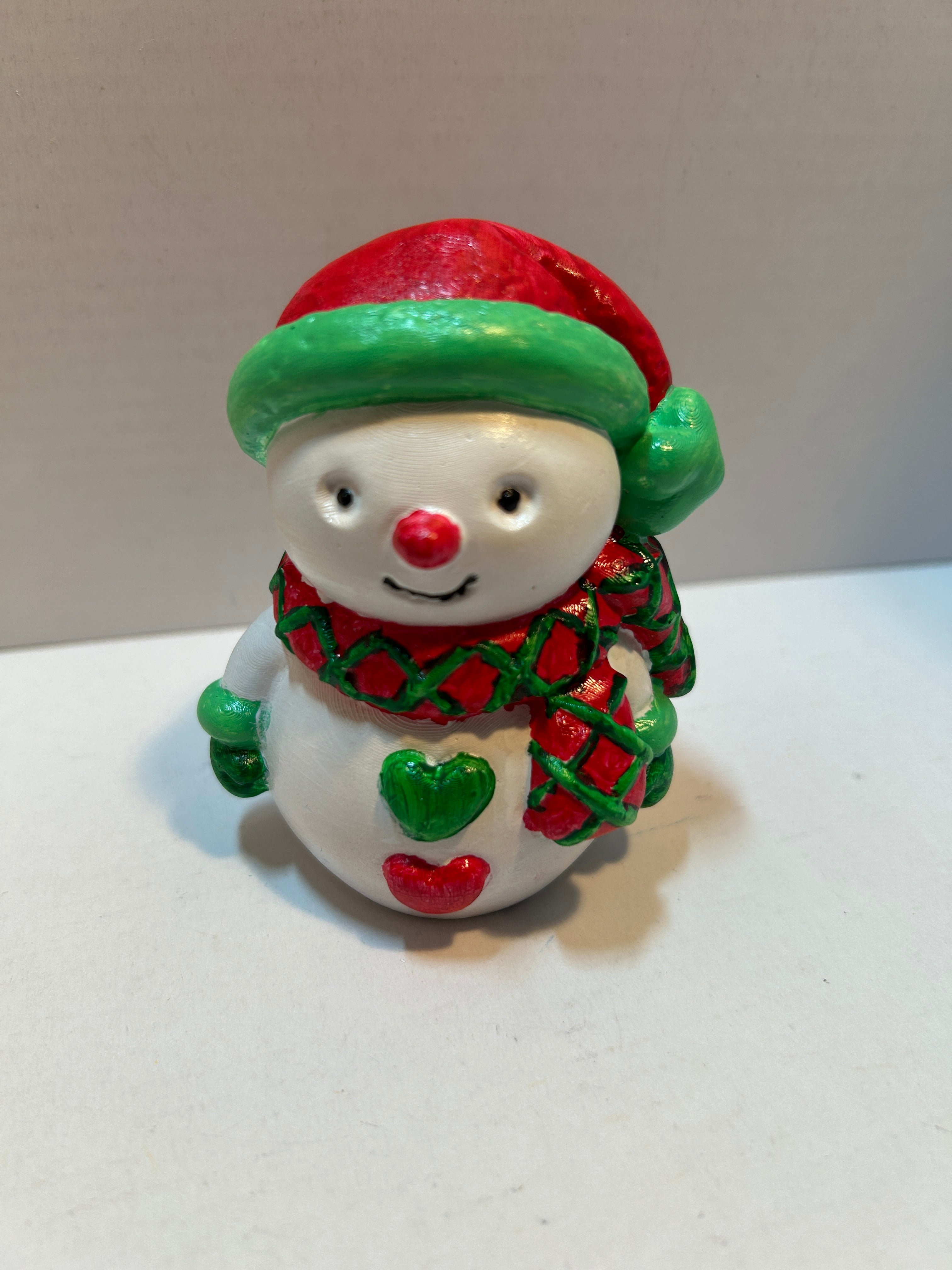 snowman figurine with hearts