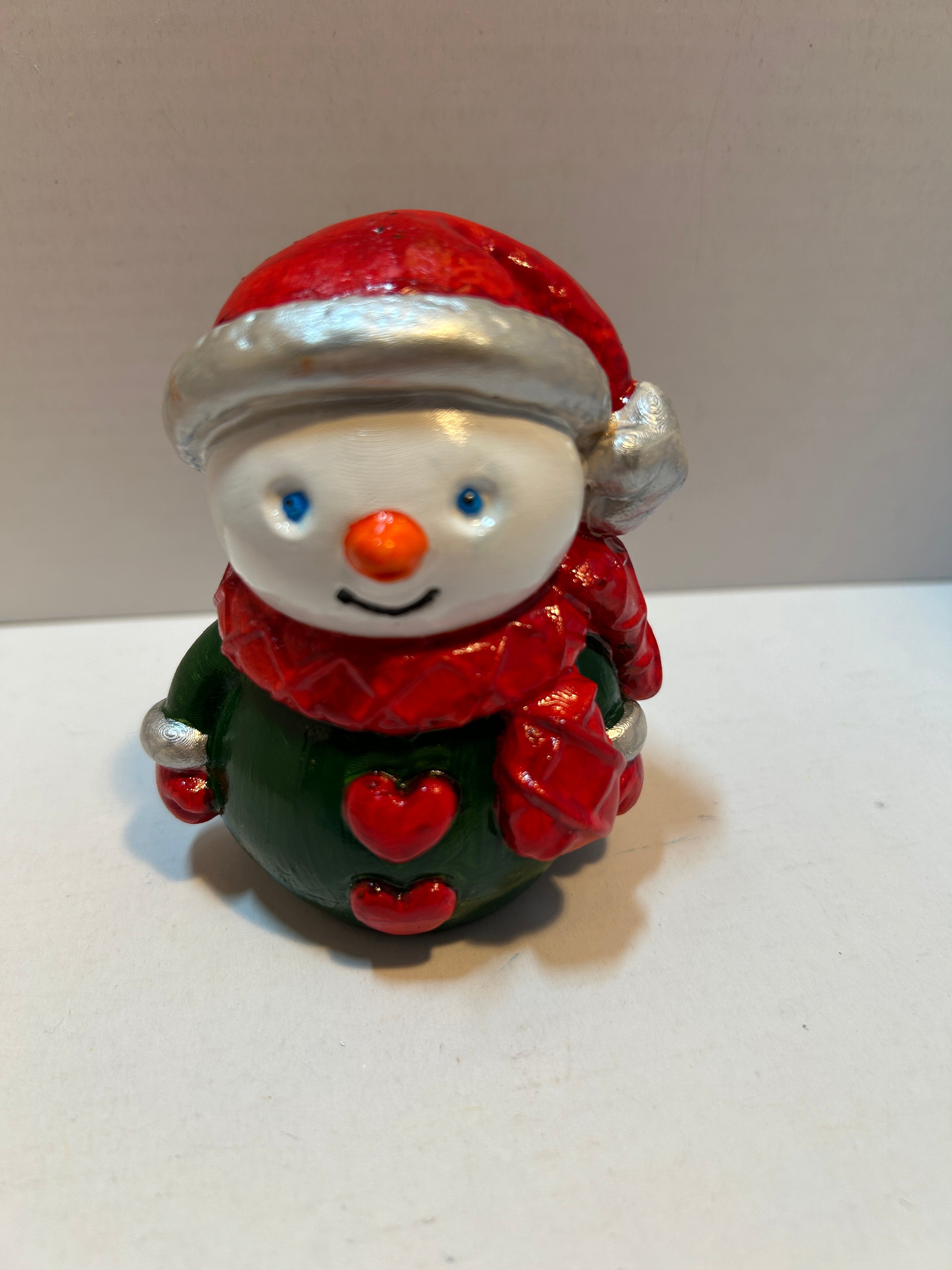 snowman figurine with hearts