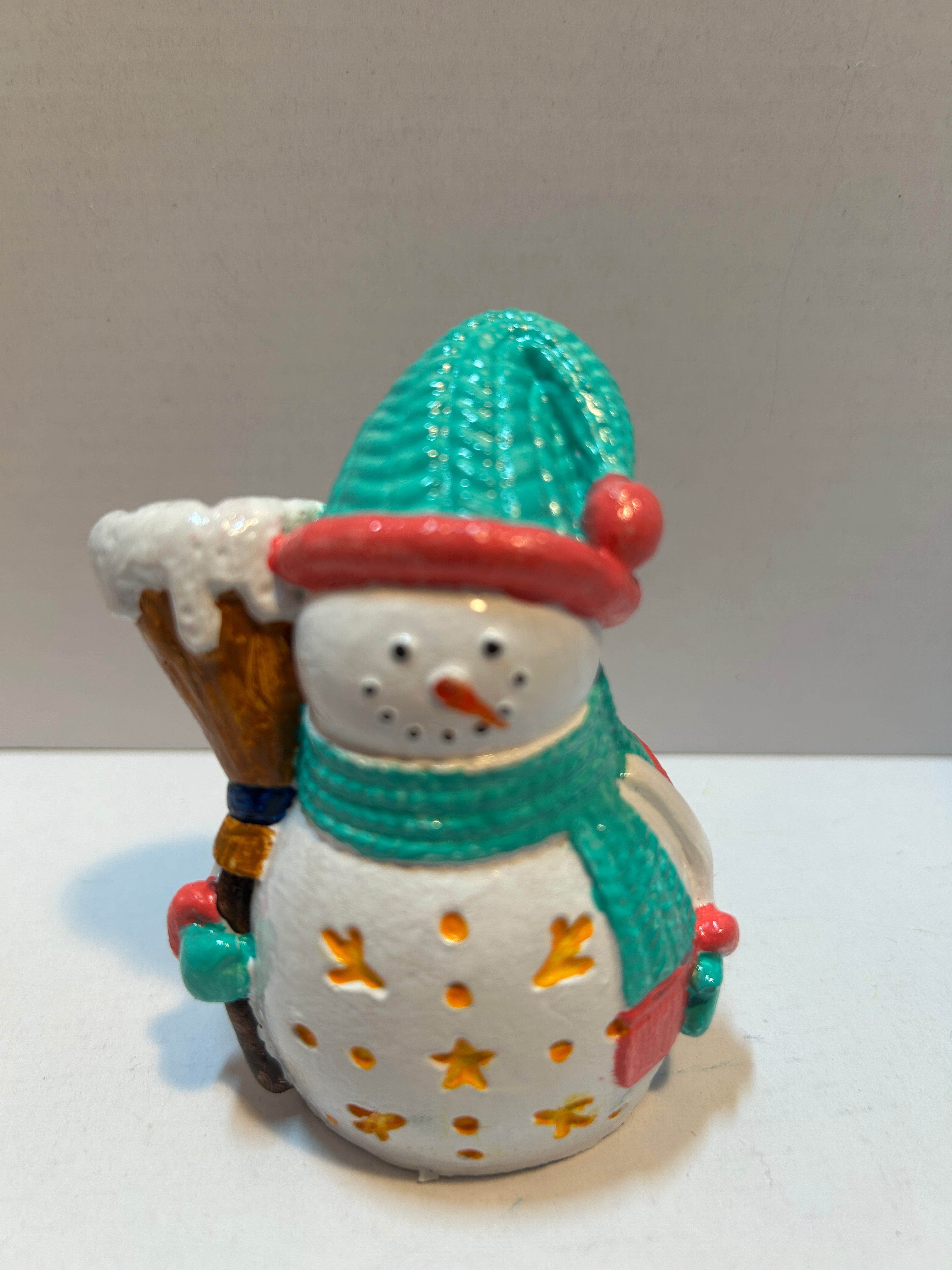 snowman figurine with stars